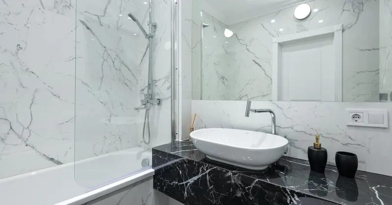 Clean modern bathroom with white fixtures and tile