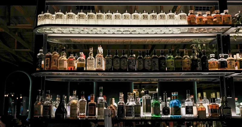 Home bar shelves filled with neatly organized bottles and glassware