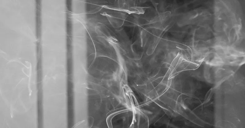 Cigarette smoke floating in a room highlighting indoor air quality