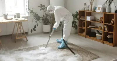 Professional carpet cleaning machine extracting dirt from beige carpet in a North Houston living