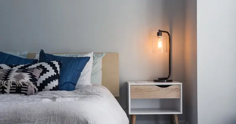 Freshly cleaned Airbnb bedroom with crisp white linens and modern decor