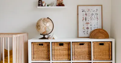 Bright and clean baby nursery with natural wood furniture