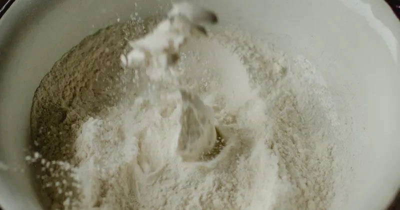White baking soda powder in a white bowl