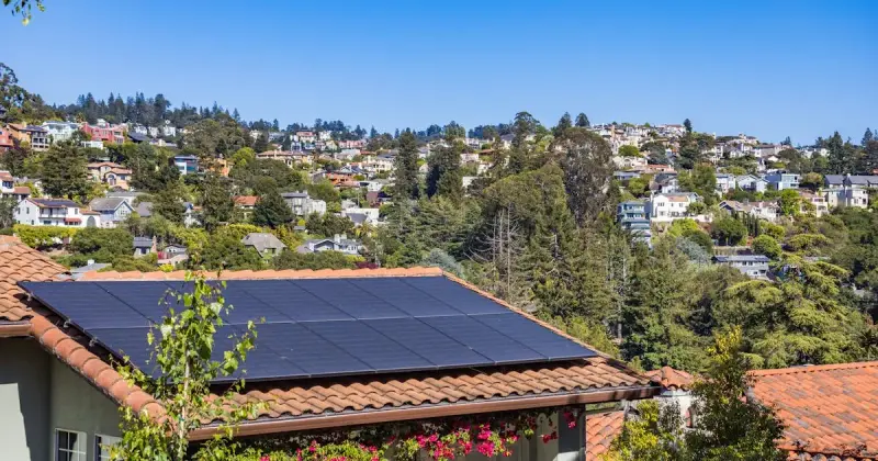 Texas home with solar panels under bright summer sunshine