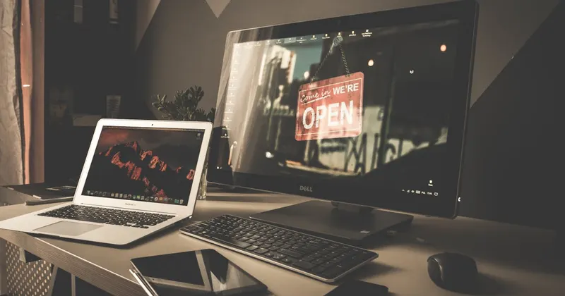 Clean organized computer workspace setup on a modern desk