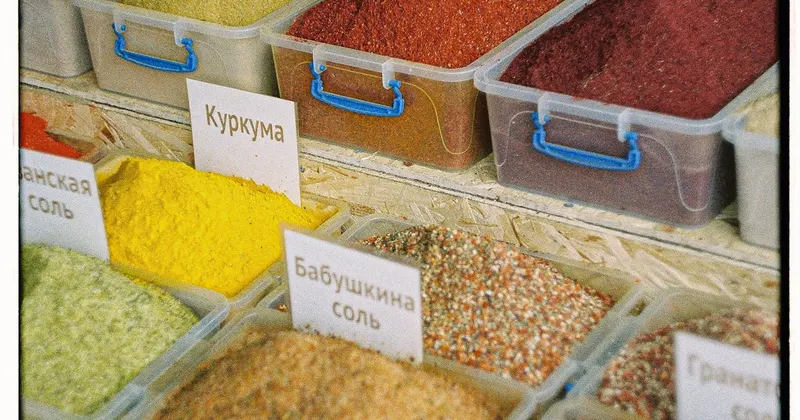 Various spices organized in labeled plastic containers