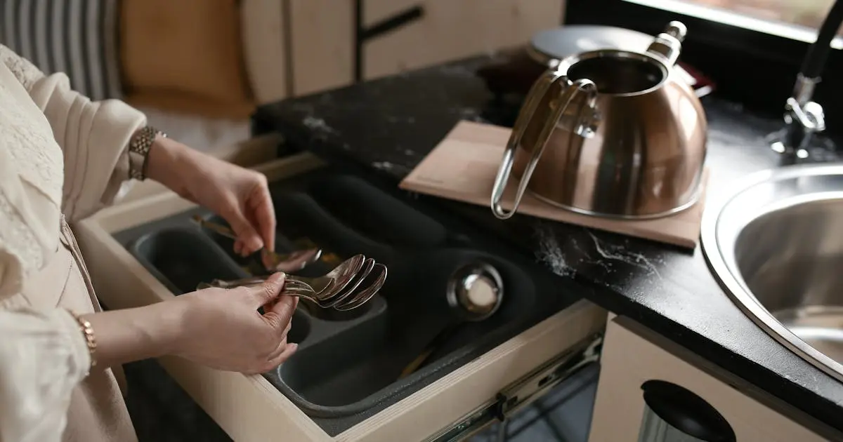 Kitchen cabinet with organized drawers for utensils