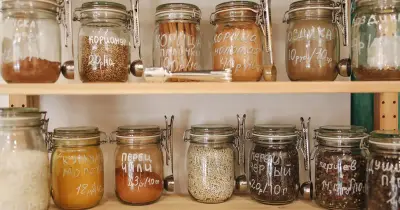 A neatly organized kitchen counter with various food storage containers.