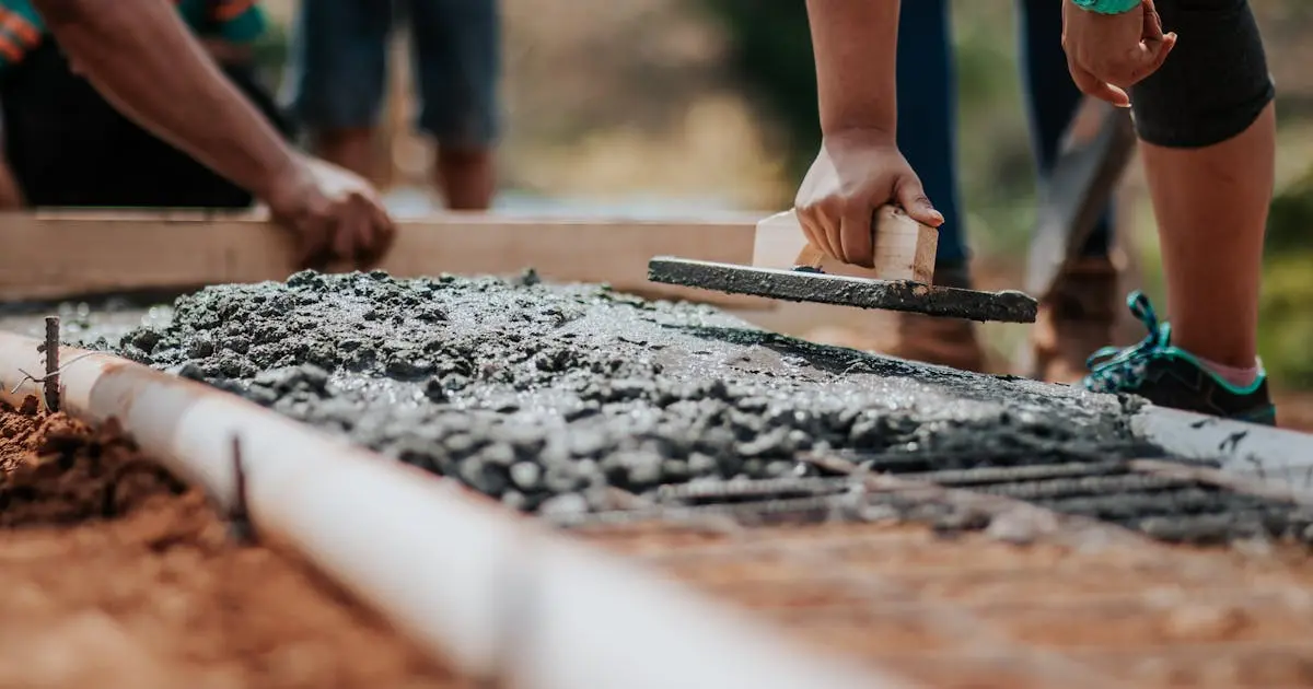 A red brick wall under construction with tools and materials scattered around in a renovation