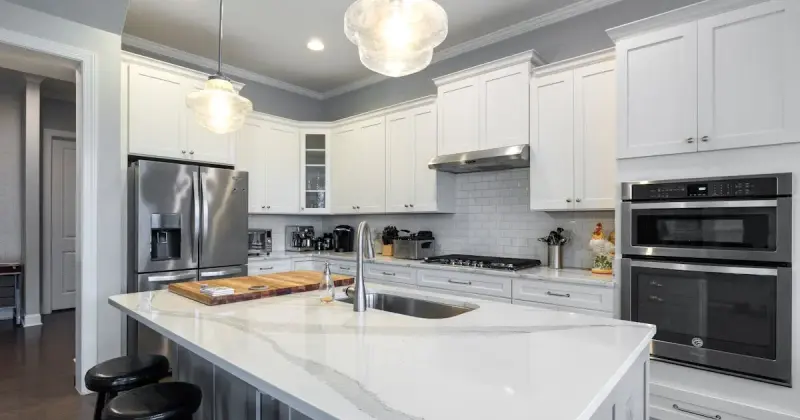 Wide view of granite and marble slabs neatly arranged in a factory setting, showcasing variety and