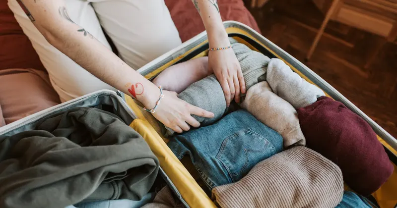 Person organizing essentials for summer season
