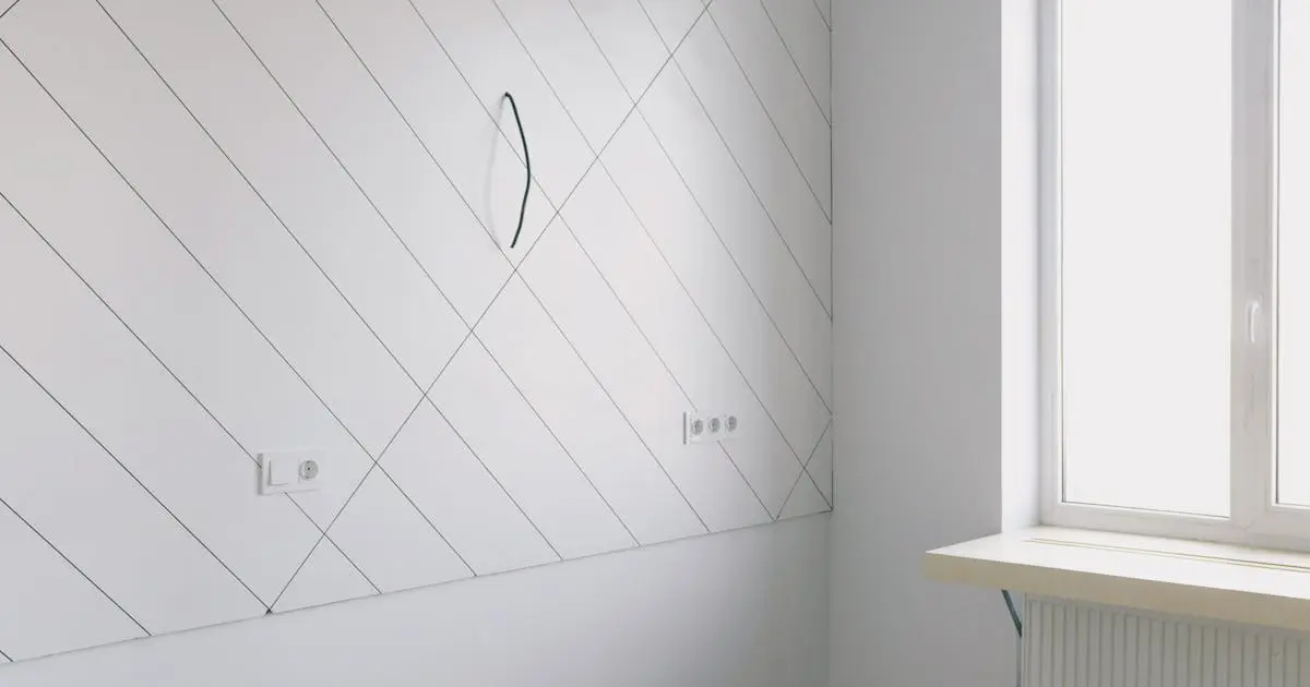 Empty room with white walls and wooden floor in a new home