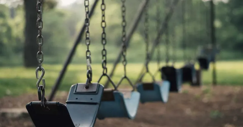 Old-fashioned copper baking pans hanging on wall in kitchen